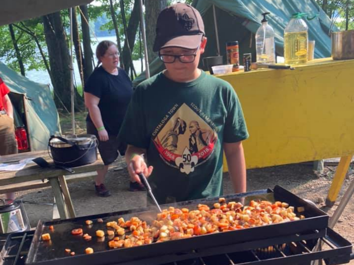 a scout learning to cook