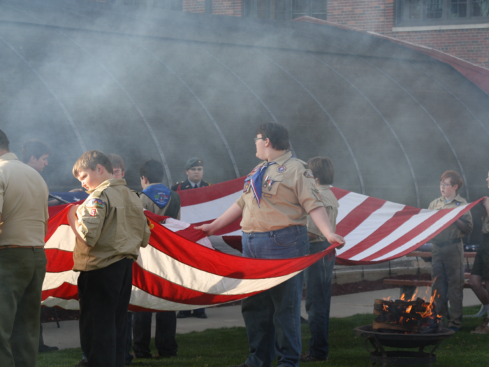 scouts participating in a flag retirement ceremony